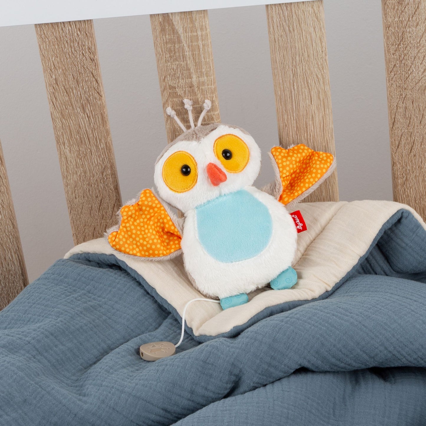 Chouette en peluche musicale